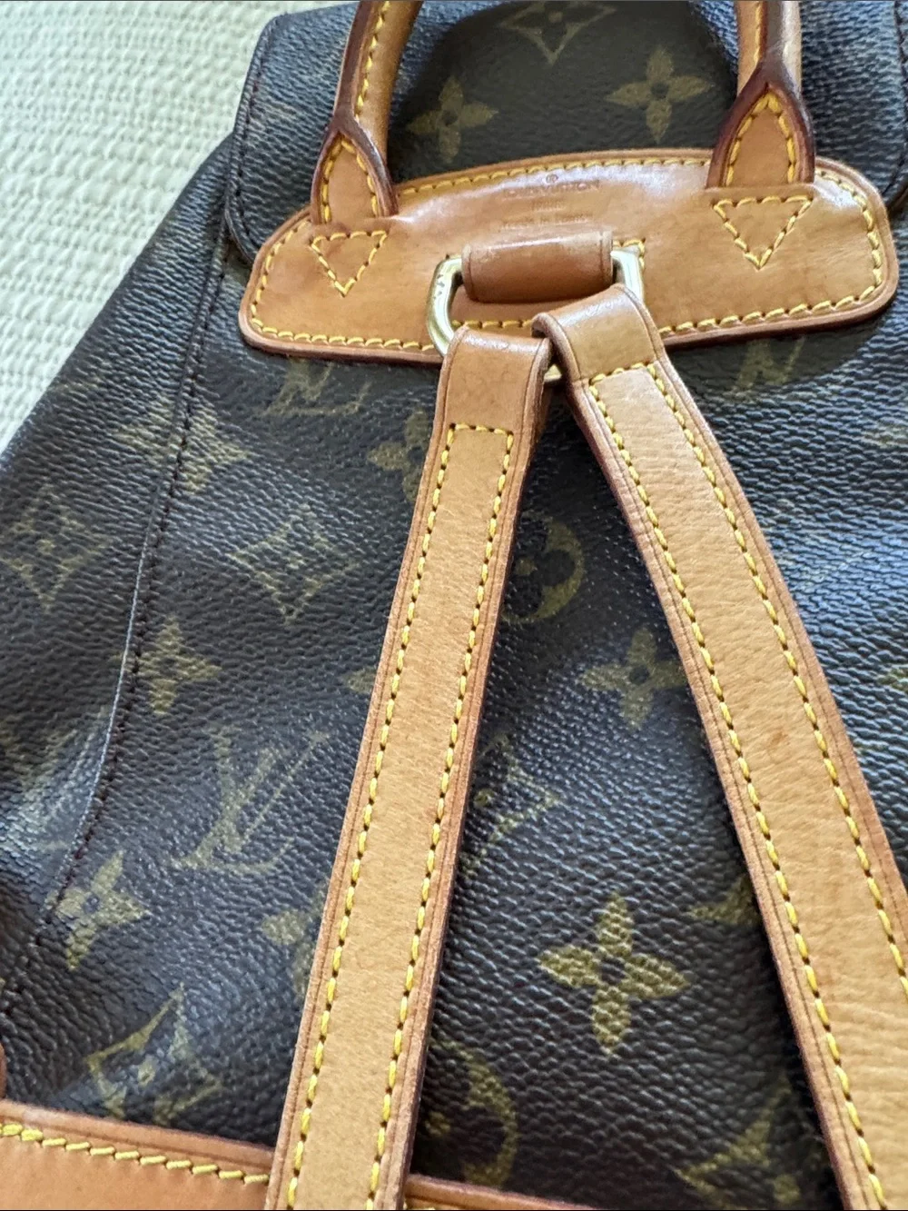 Louis Vuitton Monogram Drawstring Mini Backpack in Brown and Tan Leather Trim